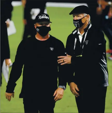  ?? ETHAN MILLER — GETTY IMAGES ?? Head coach Jon Gruden, left, and general manager Mike Mayock have the Las Vegas Raiders humming along as they face the Atlanta Falcons.