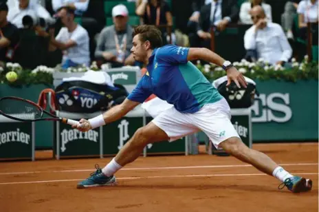  ?? CHRISTOPHE SIMON/AFP/GETTY IMAGES ?? Stan Wawrinka — the 2015 champion and, at 32, oldest French Open finalist in 44 years — stretched his win streak to a career-best 10 matches.