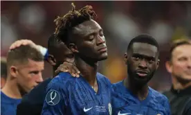  ??  ?? Tammy Abraham is consoled by his Chelsea teammates after missing a decisive penalty in Istanbul. Photograph: Matthew Ashton - AMA/Getty Images