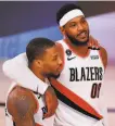  ?? Kevin C. Cox / Getty Images ?? Guard Damian Lillard, with Carmelo Anthony (00), is reason enough to watch the Portland Trail Blazers play.