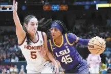  ?? AP photo ?? LSU’s Alexis Morris drives past Virginia Tech’s Georgia Amoore during the first half of the Tigers’ 79-72 win in the Final Four on Friday.