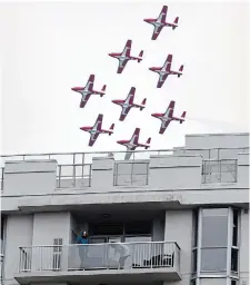  ?? GRAHAM PAINE TORSTAR ?? The Snowbirds flew over downtown Burlington as part of their “Operation Inspiratio­n,” a cross-country salute to Canadians helping fight the spread of COVID-19, giving some condo residents a view.