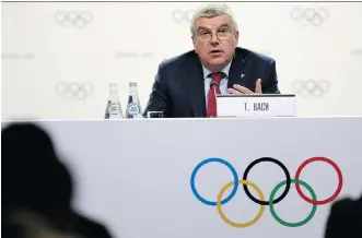  ?? NATACHA PISARENKO/THE ASSOCIATED PRESS ?? Internatio­nal Olympic Committee president Thomas Bach speaks at press conference in Buenos Aires, Argentina, on Thursday. Bach said three bids will be proposed as official candidates for approval by the full membership next week. They are: Calgary, Canada; Stockholm, Sweden; and the combined Italian bid of Milan and Cortina d’Ampezzo.
