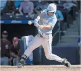  ?? ROBERT WILLETT/THE RALEIGH NEWS & OBSERVER VIA AP ?? North Carolina’s Michael Busch connects for a home run against Boston College in an ACC semifinal game.