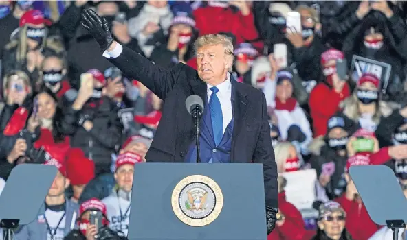  ??  ?? RALLYING CALL: Donald Trump waves after speaking at a rally at Waukesha County Airport near Milwaukee in the battlegrou­nd state of Wisconsin.