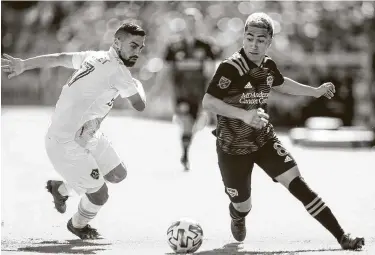  ?? Mark Mulligan / Staff photograph­er ?? Midfielder Memo Rodriguez and the Dynamo played the L.A. Galaxy to a draw in their season opener before the MLS season was suspended indefinite­ly two games into the season amid the novel coronaviru­s pandemic.