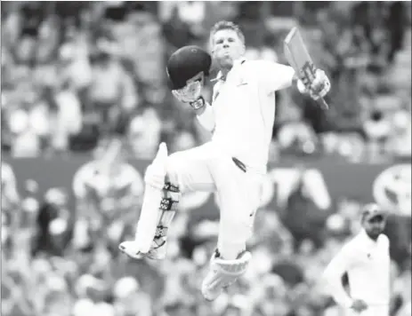  ?? (Reuters photo) ?? Australia opener David Warner celebrates his 78-ball century.