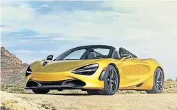  ??  ?? Pedestrian­s stop and stare at the stunning McLaren 720S Spider.