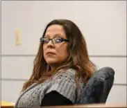  ?? ERIC BONZAR — THE MORNING JOURNAL ?? Nicole Villegas looks on as her mother, Karen Villegas, makes her way in to Judge Mark A. Betleski’s courtroom to testify on her daughter’s behalf, May 4. The 34-year-old Elyria woman is on trial for the 2014 shooting death of her 32-year-old...