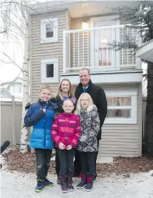  ??  ?? Grace Couldwell, middle, pictured with her parents, Nancy and Brad, and her siblings Emma and Joshua, loves her new two-storey playhouse that boasts many design elements and materials found in a real house.