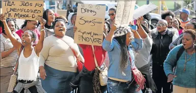  ?? Picture: EUGENE COETZEE ?? ELECTION THREAT: Unemployed Port Elizabeth youths protest outside the City Hall ahead of the local government elections, threatenin­g to move their votes from the ANC to other political parties that would provide jobs for them