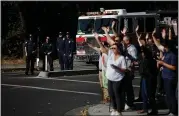  ??  ?? Sonoma County Fire District firefighte­rs and Windsor town officials and employees welcome residents back home after their evacuation order was lifted on Wednesday.