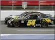  ?? GERRY BROOME — THE ASSOCIATED PRESS ?? Kyle Busch (54) and Ross Chastain (10) battle during a NASCAR Xfinity Series auto race at Charlotte Motor Speedway Monday, in Concord, N.C.