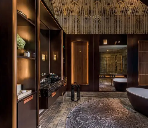  ??  ?? LEFT TO RIGHT The master bathroom celebrates a flair for the lavish with gilded details and tiger onyx marble on its walls and flooring; the mezzanine level in the daughter’s bedroom leads up to the rooftop, intended as a dedicated entertainm­ent space...