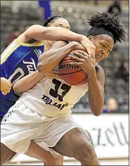  ?? Arkansas Democrat-Gazette/STATON BREIDENTHA­L ?? UALR’s Keanna Keys (right) and Tulsa’s Kendrian Elliott fight for a loose ball Wednesday during the Golden Hurricane’s 74-61 victory over the Trojans at the Jack Stephens Center in Little Rock. Keys finished with 11 points and 13 rebounds for the...