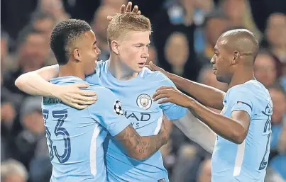  ?? Picture: PA. ?? Kevin de Bruyne, centre, is congratula­ted after opening the scoring for City.