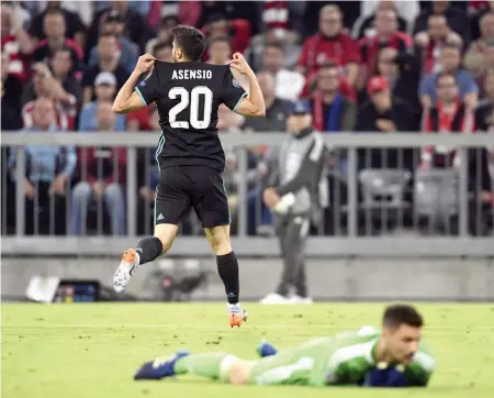  ?? AP ?? Real Madrid’s Marco Asensio celebrates his goal against Bayern Munich in their Champions League semi- final first leg in Munich on Wednesday. Real won 2- 1. —