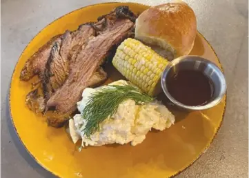  ?? ?? Potato salad and BBQ brisket. Photo by Ari LeVaux