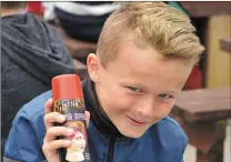  ?? Up and coming local oarsman Mikey O’Leary seemed to be promoting the benefits of hairspray at Sunday’s regatta. ??