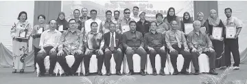  ??  ?? Louis (from third right)and Masiung with other invited guests and award recipients during yesterday’s ceremony.