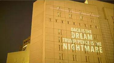  ??  ?? Pause for thought: An anti-Trump administra­tion message being projected onto the side of the Metropolit­an Detention Centre in Los Angeles, where many undocument­ed people are jailed. — AFP
