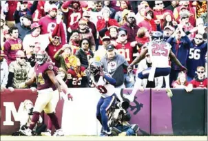  ?? AFP ?? Justin Reid of the Houston Texans celebrates after scoring a 101 yard touchdown on an intercepti­on in the second quarter at FedExField in Landover, Maryland.