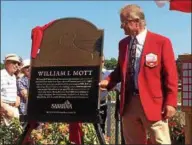  ?? PAUL POST — PPOST@DIGITALFIR­STMEDIA.COM ?? Hall of Fame trainer Bill Mott unveils his plaque for the Saratoga Walk of Fame on Friday.