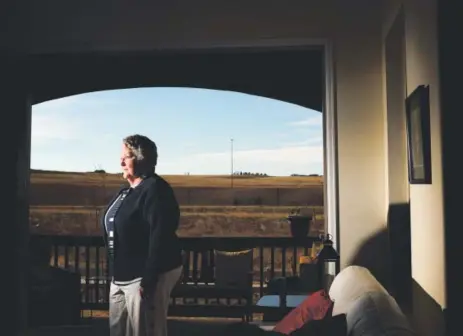  ??  ?? Susan Speece, at her home in the Anthem neighborho­od, is opposed to the proposed plan for a drilling pad near her community. A rebound in oil prices is spurring a rebound in drilling, including close to residentia­l areas. RJ Sangosti, The Denver Post