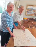  ?? LVN131219c­ulls ?? Stan and Alison with the 1957 map from the Drainage Board which shows the district when flood mitigation was still in the planning stations.