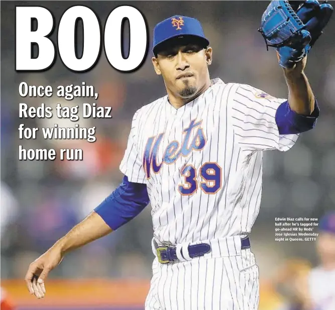  ??  ?? Edwin Diaz calls for new ball after he’s tagged for go-ahead HR by Reds’ Jose Iglesias Wednesday night in Queens. GETTY