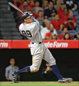  ?? SEAN M. HAFFEY / GETTY IMAGES ?? The Yankees’ Aaron Judge led the American League with 52 homers, the most ever by a rookie. He’s also a finalist for the league’s MVP award.