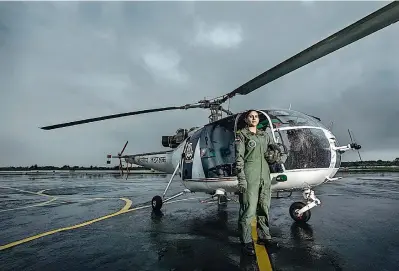  ??  ?? A pilot from the Indian Coast Guard ready to take off on a search and rescue mission