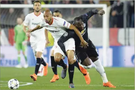  ??  ?? Manchester United’s Romelu Lokaku (right) and Sevilla’s Clement Lenglet battling for ball during their UEFA Champions League Last 16 first leg clash in Seviille, Spain last night. The game ended goalless.