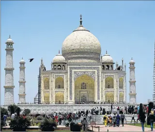  ?? Picture: GETTY IMAGES ?? SAVING HERITAGE: Visitors to the majestic Taj Mahal, the iconic monument to love, will in future be restricted in number in an effort to preserve it