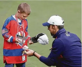  ?? Jamie Squire / Getty Images ?? With so little success recently, the U.S. turned to someone who knows about winning internatio­nal competitio­ns to address the team, with swimmer Michael Phelps also serving as a popular figure while playing in a celebrity event Tuesday.