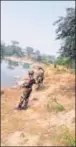  ??  ?? Army personnel guard Chitora dam. HT PHOTO