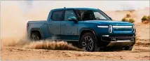  ?? COURTESY ?? Rivian is expected to deliver its new electric truck to consumers starting in March. The company has one manufactur­ing site in Illinois but is expected to build another factory in Georgia, east of Atlanta, to manufactur­e trucks and SUVS.