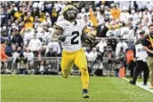  ?? AP ?? Michigan running back Blake Corum rushed for 145 yards and two touchdowns in the Wolverines’ 24-15 defeat of Penn State on Saturday in State College, Pa.