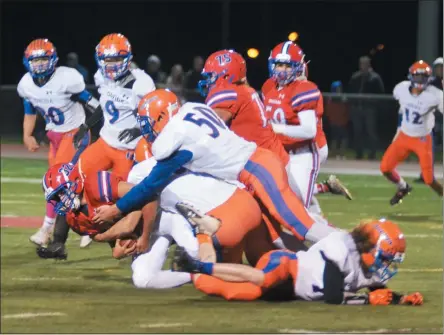  ??  ?? In this file photo, Oneida defensive lineman Aiden Guy (50) assists teammate Hunter West with a tackle on New Hartford running back Tyler Potocki. On Saturday, the Oneida defense will face its toughest task yet in unbeaten Solvay in the Class B finals.