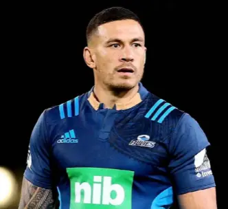  ??  ?? Sonny Bill Williams with the BNZ logo on his collar hidden. Below, his manager, Khoder Nasser.