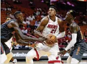  ?? WILFREDO LEE / ASSOCIATED PRESS ?? A knee injury that occurred during the opener against Orlando in October forced Hassan Whiteside to miss his sixth game of the season Wednesday night against the Knicks in New York.