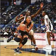  ?? Tyler Sizemore / Hearst Connecticu­t Media ?? UConn’s Azzi Fudd drives to the basket against NC State at the XL Center in Hartford on Sunday.