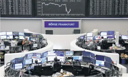  ?? REUTERS/STAFF ?? The German share price index DAX graph is pictured at the stock exchange in Frankfurt, Germany, last week.