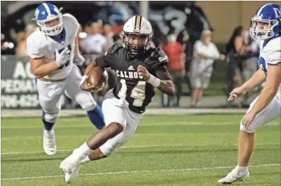  ?? Tim Godbee ?? Calhoun quarterbac­k Christian Lewis weaves his way for a big gain during the Jackets’ home loss Friday night to Chattanoog­a McCallie.