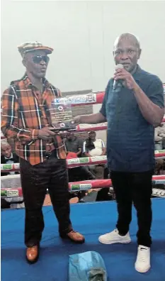  ?? Picture: SUPPLIED ?? HONOUR: Xolani Kemka, left, receives an award of honour from Xolani Jamani at the Whittlesea Multi-purpose Centre.