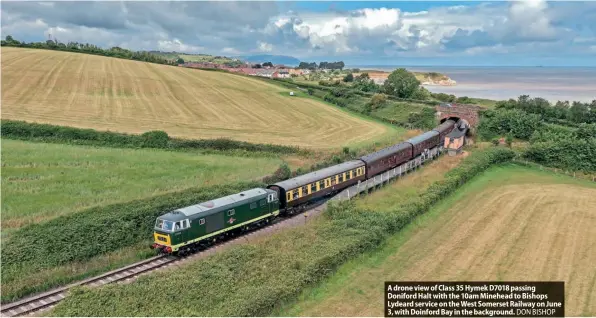  ?? ?? A drone view of Class 35 Hymek D7018 passing Doniford Halt with the 10am Minehead to Bishops Lydeard service on the West Somerset Railway on June 3, with Doinford Bay in the background. DON BISHOP