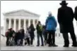  ?? JACQUELYN MARTIN — THE ASSOCIATED PRESS ?? People wait in line to enter the Supreme Court, Wednesday in Washington, where the court will hear arguments on a gerrymande­ring case.