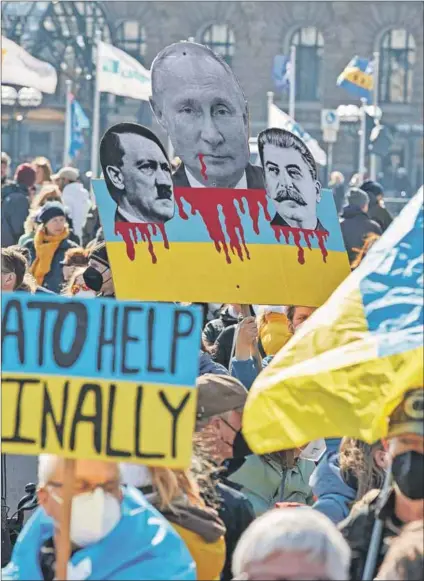  ?? Photo: George WENDT/DPA/AFP ?? Backlash: The citizens of Hamburg in Germany protest against Vladimir Putin’s invasion of Ukraine. Germany is to increase its defence spending to ‘defend freedom and democracy’ and Finland and Sweden are now considerin­g joining Nato.