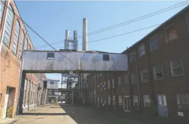  ?? STAFF PHOTOS BY C.B. SCHMELTER ?? Peerless Woolen Mills is seen on Friday in Rossville, Ga. The derelict factory will go up for auction Thursday.