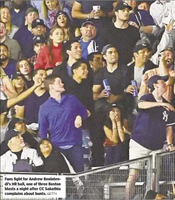  ?? GETTY ?? Fans fight for Andrew Benintendi’s HR ball, one of three Boston blasts a night after CC Sabathia complains about bunts.